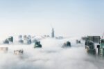 Futuristic cityscape covered in fog